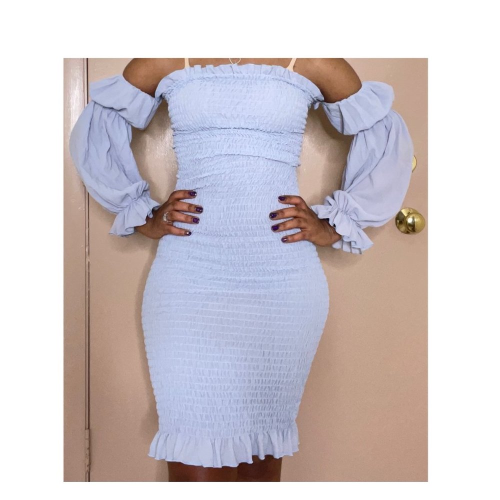 Long sleeve off shoulder bandage dress.